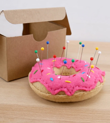 Rainbow sprinkles on pink frosted fleece donut pincushion