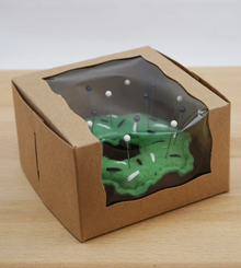 Green frosted chocolate fleece donut pincushion in box