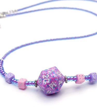 Closeup of pink and purple beaded dice necklace
