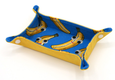 Yellow and blue snap tray featuring cartoon banana print